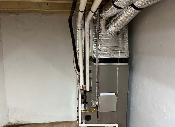 Furnace and Insulated Heating Ducts in Basement